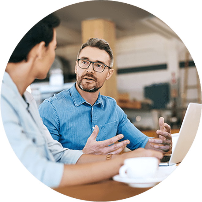 coworkers holding meeting