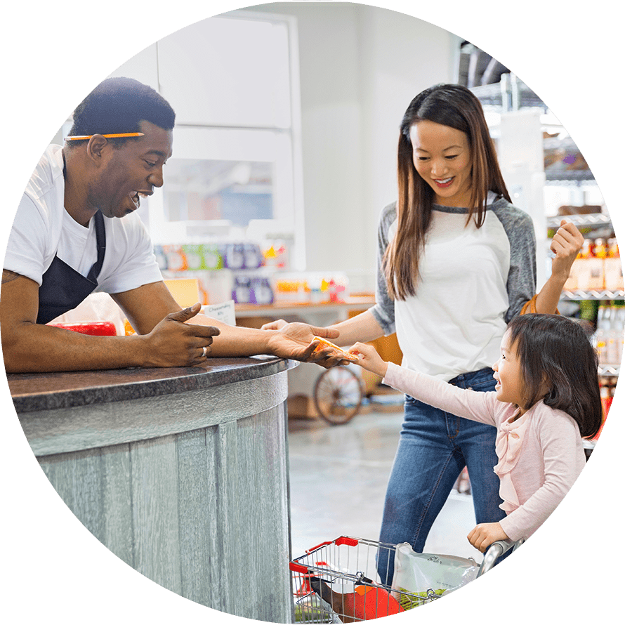 kid checking out at store with mom