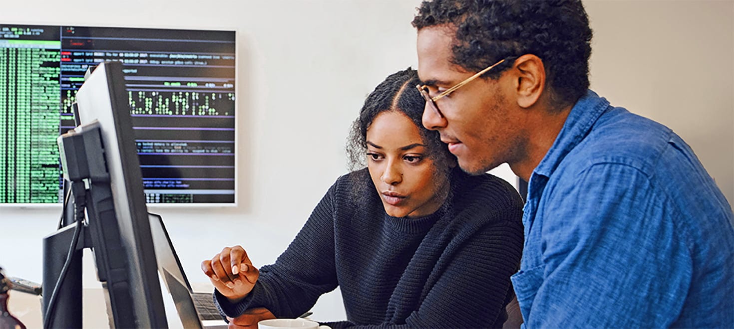 two people working together