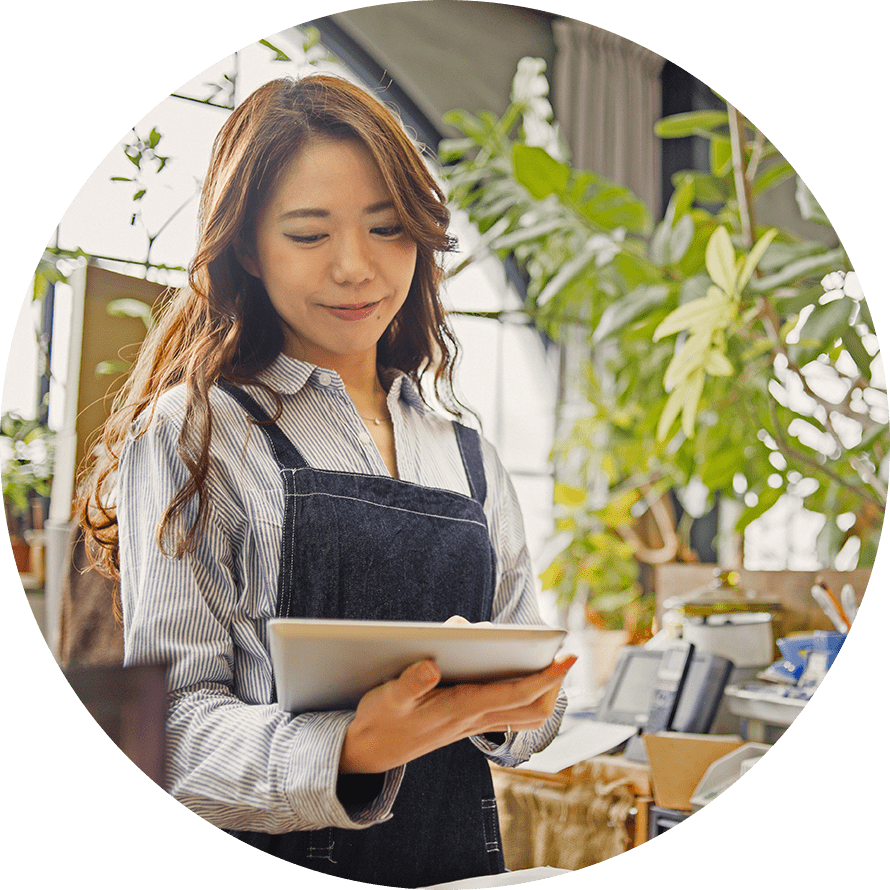 business owner reviewing files on tablet