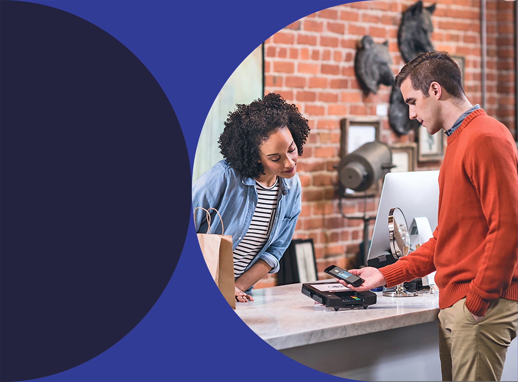 person paying with phone at store