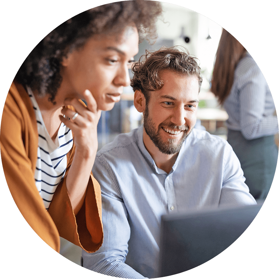 two people working together on laptop